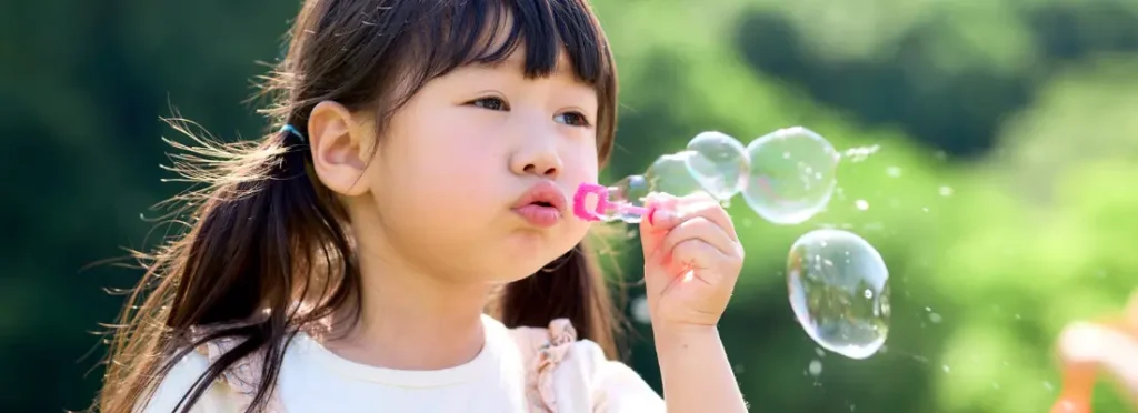 Summer Boredom Busters for Kids playing with bubbles