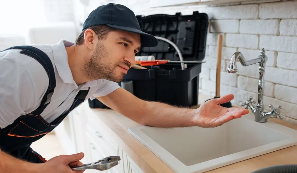 plumber is fixing a Leaking Tap