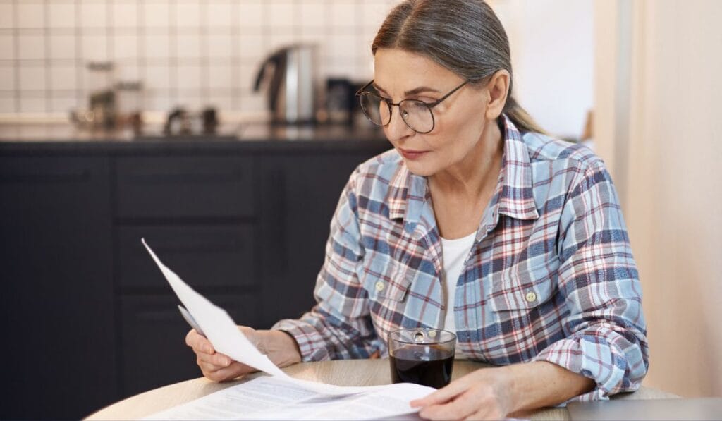 old lady reading bill image