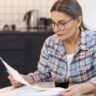 old lady reading bill image