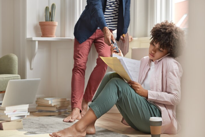 A girl is sitting in the floor image